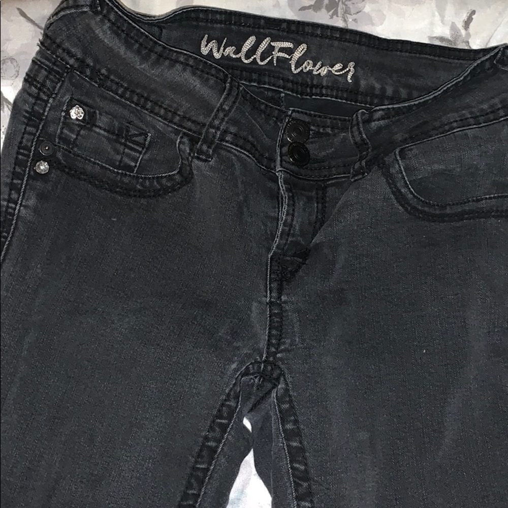 Plain pair of black jeans .